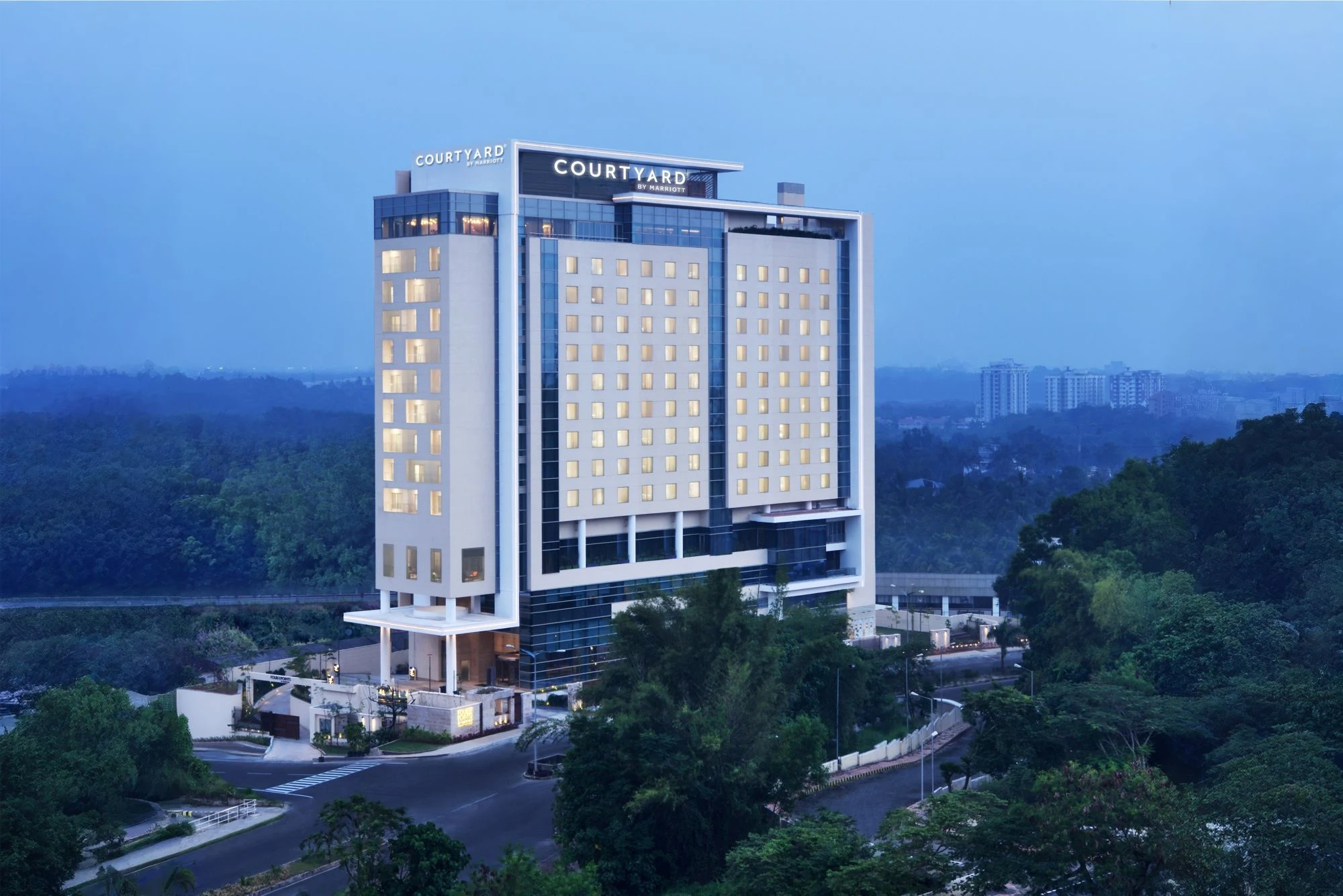 Courtyard by Marriott Kochi Infopark exterior at dusk