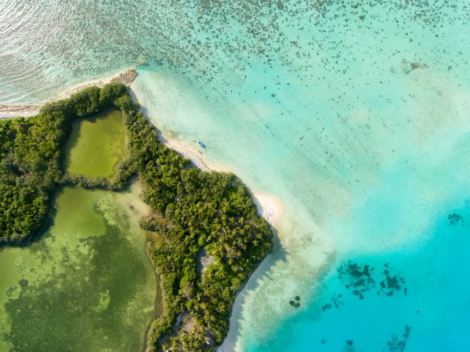 An island surrounded by turquoise water