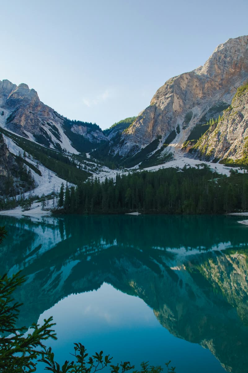 Mountain peaks reflected in a quiet alpine lake