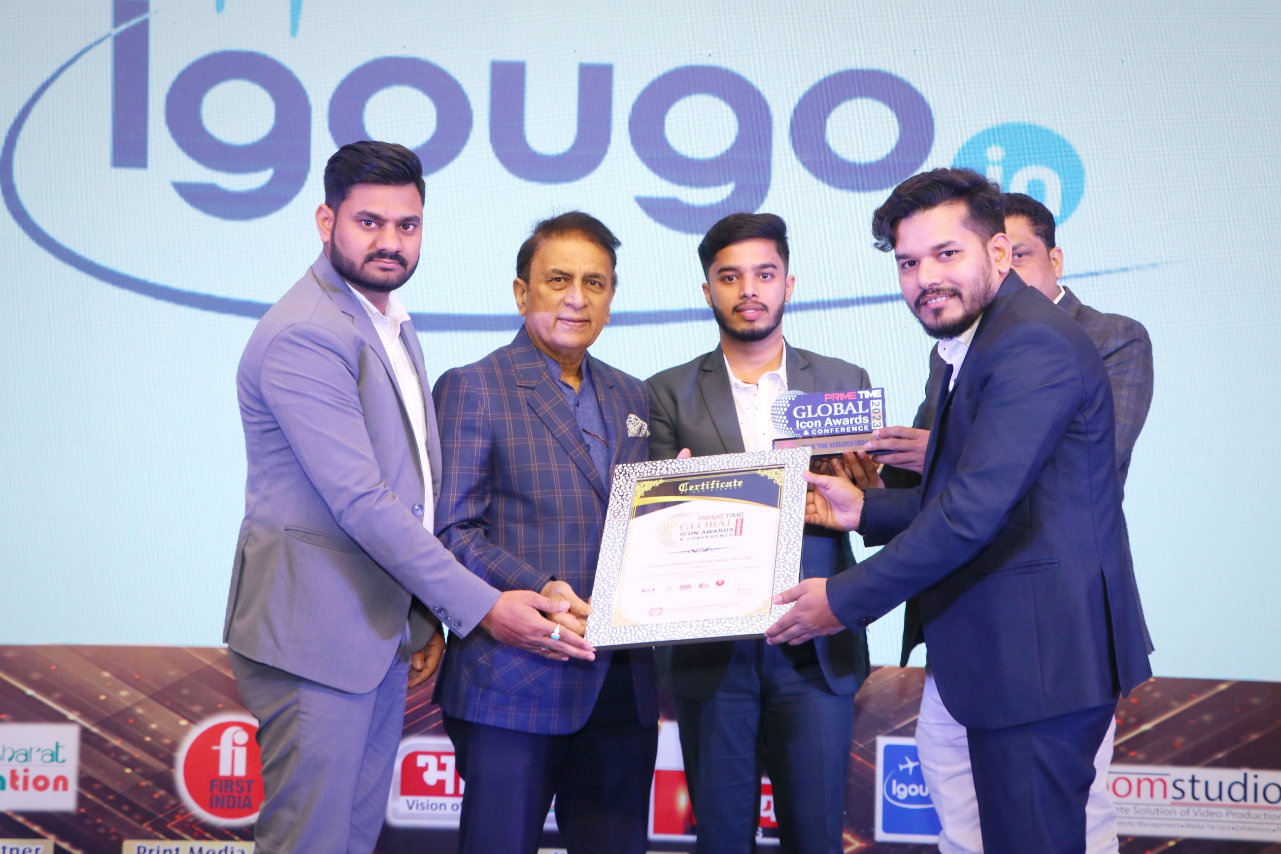 Country Holidays Travel representatives receiving a certificate and trophy at the 2023 Global Icon Awards