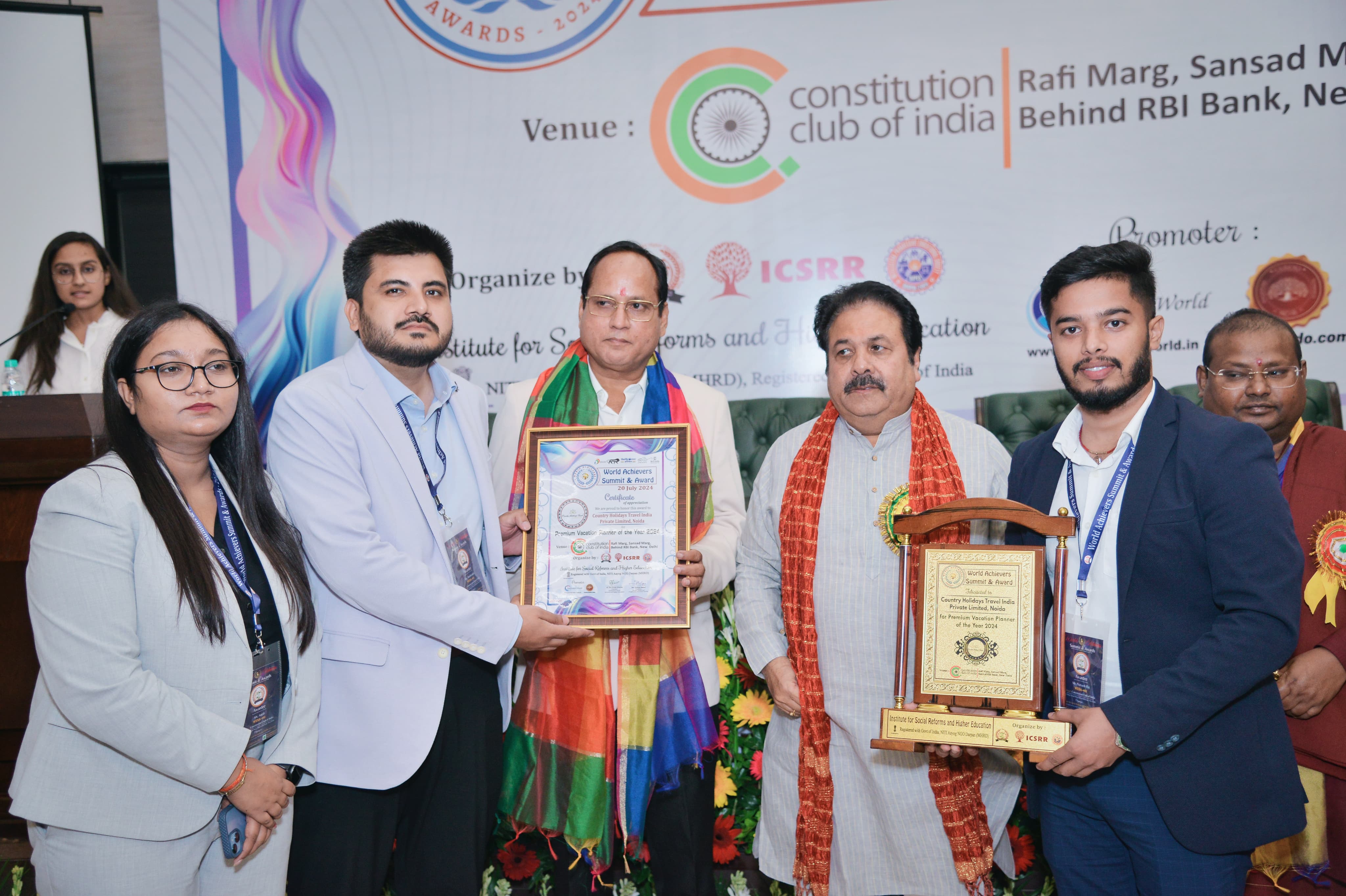 Country Holidays Travel representatives receiving the 2024 vacation planner award at the Constitution Club of India
