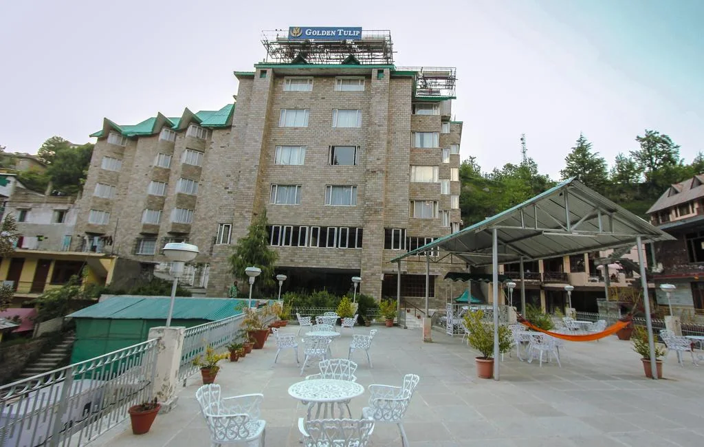 Hotel exterior and open terrace at Golden Tulip Manali.